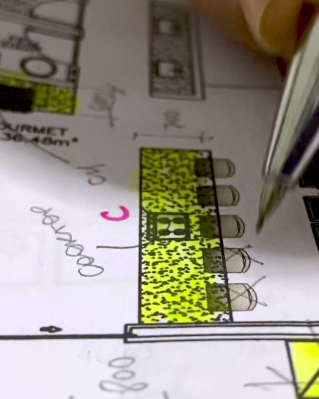 Kitchen plans being drawn by hand