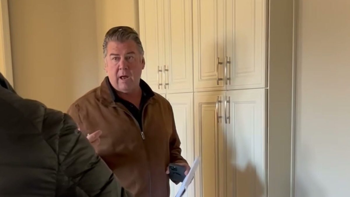Walking through a customer&rsquo;s kitchen with the plans in hand