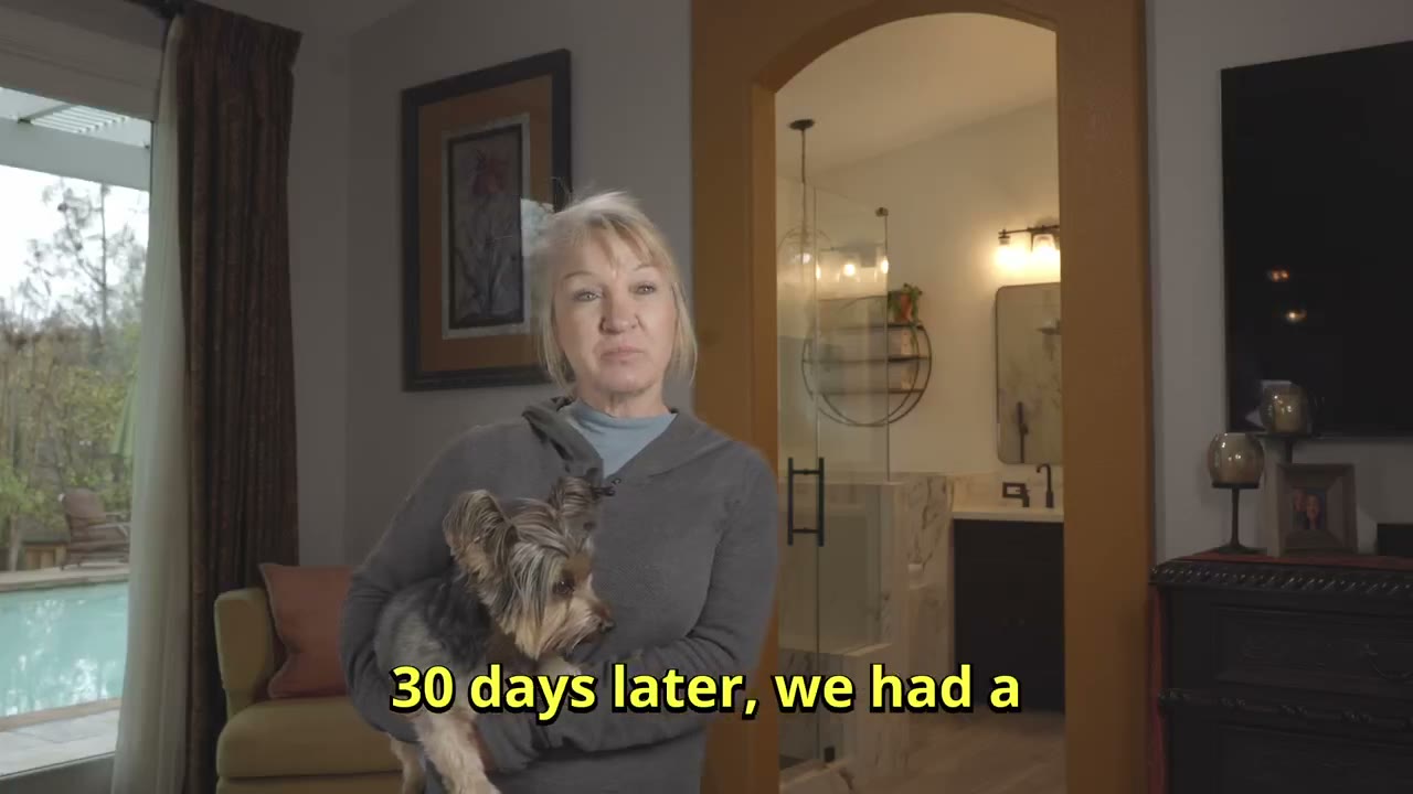 A Valley Home Construction customer at home after her bathroom remodel